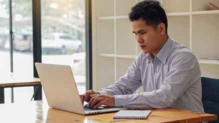 A,Young,Businessman,Working,At,Home,With,A,Laptop,On