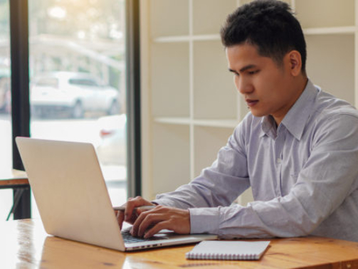 A,Young,Businessman,Working,At,Home,With,A,Laptop,On